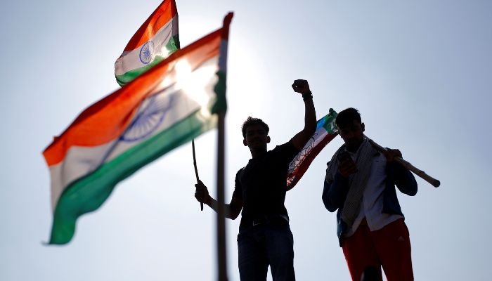 Farmers hold flags as they take part in a three-hour chakka jam or road blockade, as part of protests against farm laws on a highway on the outskirts of New Delhi, India, February 6, 2021. —Reuters