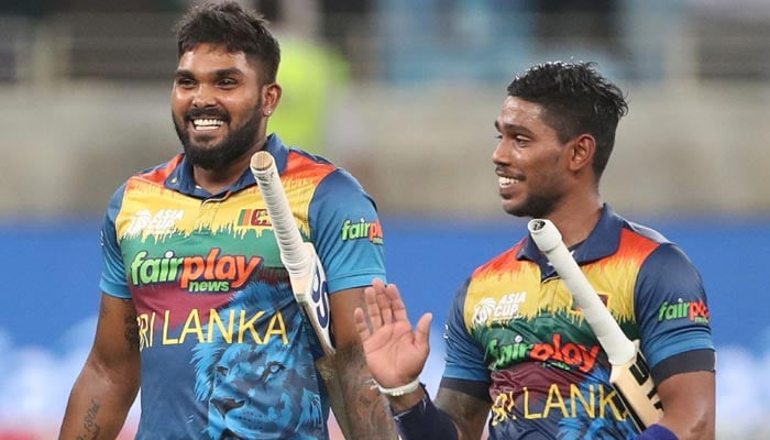 Sri Lanka´s Pathum Nissanka (R) and Wanindu Hasaranga leave the field after winning the Asia Cup Twenty20 international cricket Super Four match between Pakistan and Sri Lanka at the Dubai International Cricket Stadium in Dubai on September 9, 2022. — AFP