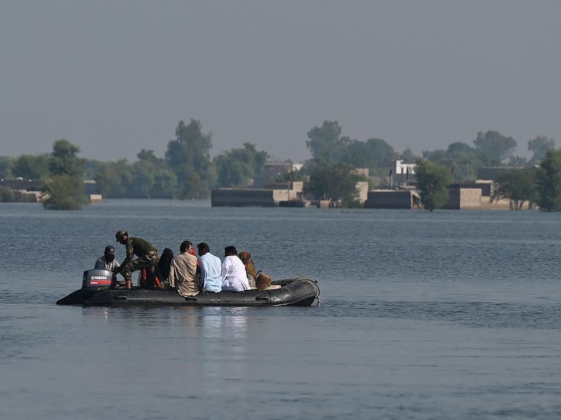 Members of Pakistan Navy personnel take part in a rescue operation in flooded Mehar city after heavy monsoon rains in Dadu district, Sindh province on September 9, 2022. — AFP