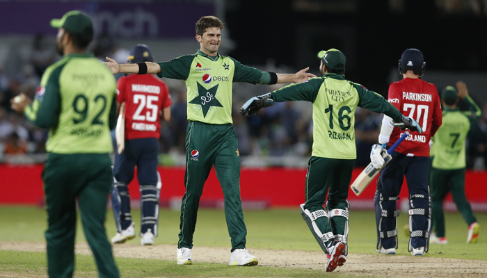 Cricket - First Twenty20 International - England v Pakistan - Trent Bridge, Nottingham, Britain - July 16, 2021 Pakistans Shaheen Afridi celebrates with teammates after taking the wicket of Englands Matt Parkinson to win the match. — Reuters