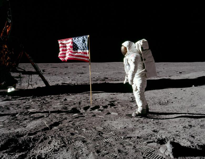 Astronaut Buzz Aldrin, lunar module pilot for Apollo 11, poses for a photograph beside the deployed U.S. flag during an extravehicular activity on the surface of the moon, July 20, 1969. — Reuters