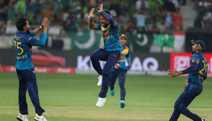 Pramod Madushan (C) celebrates with teammates after dismissing Pakistans Babar Azam (not pictured) during the Asia Cup final between Pakistan and Sri Lanka at the Dubai International Cricket Stadium. — AFP