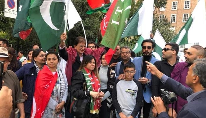 PTI supporters protest outside the Pakistan High Commission to convey a loud and clear message that they would not accept the “minus-one formula”. — Murtaza Ali Shah