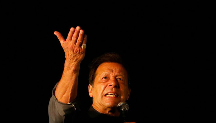 PTI Chairman Imran Khan gestures as he addresses supporters during a rally, in Karachi, Pakistan April 16, 2022. — Reuters