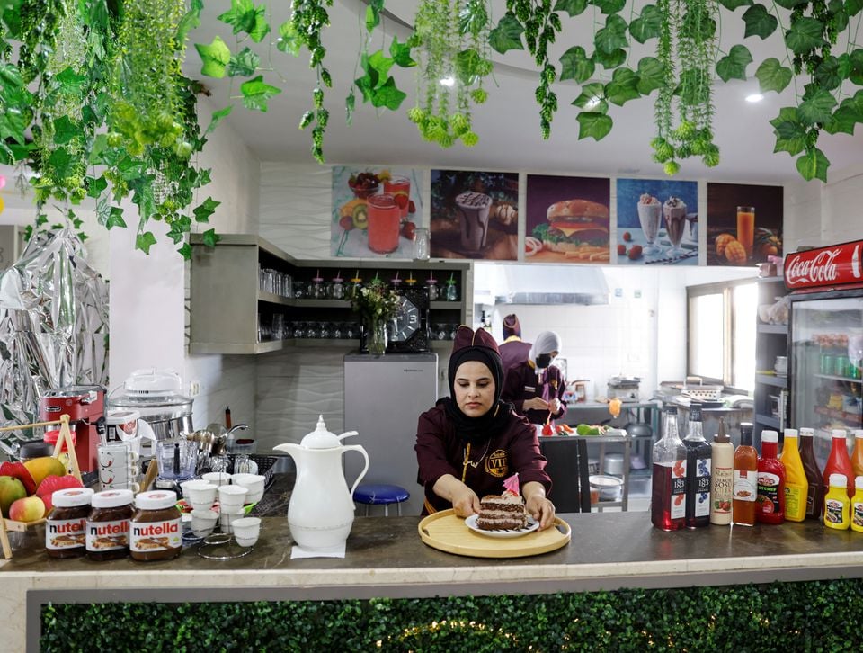 A Palestinian waitress work at the newly-opened women-only restaurant, called Sabaia VIP, in Gaza City September 6, 2022. — Reuters