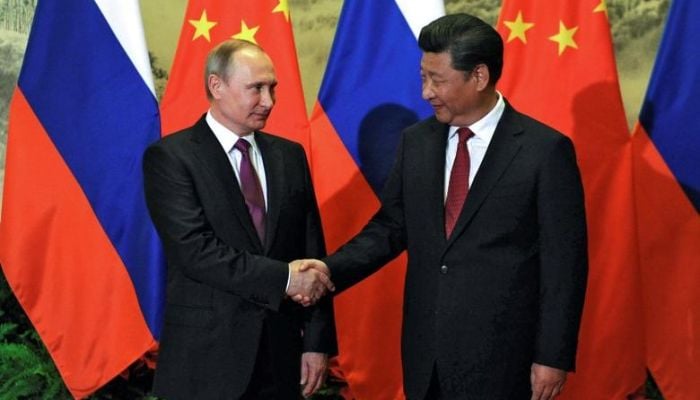 Chinese President Xi Jinping shakes hands with his Russian counterpart Vladimir Putin during a welcoming ceremony in Beijing, China, June 25, 2016. — Reuters