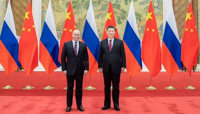 Russian President Vladimir Putin with Chinese President Xi Jinping during their meeting on the sidelines of a BRICS summit, in Brasilia, Brazil, November 13. — Reuters/File