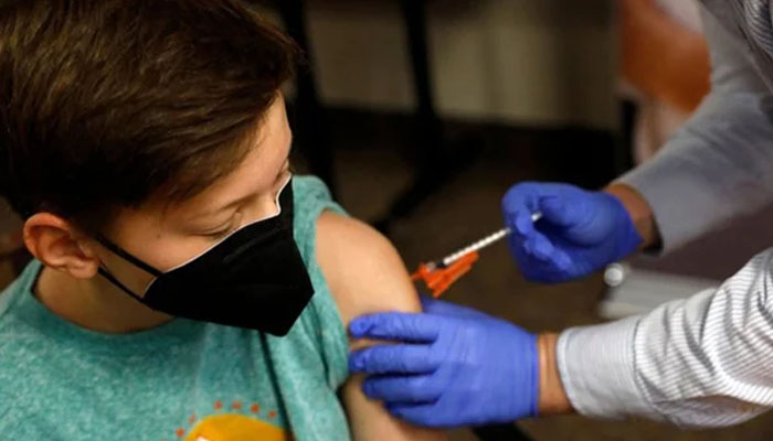 Health worker is vaccinating children. — AFP/File