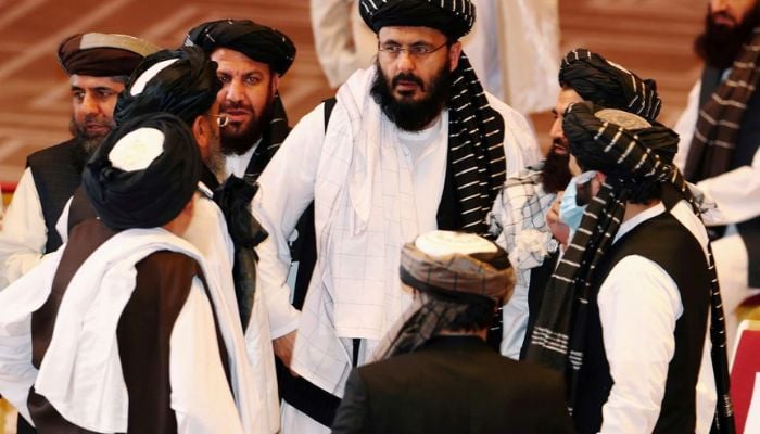 Taliban delegates speak during talks between the Afghan government and Taliban insurgents in Doha, Qatar September 12, 2020. — Reuters