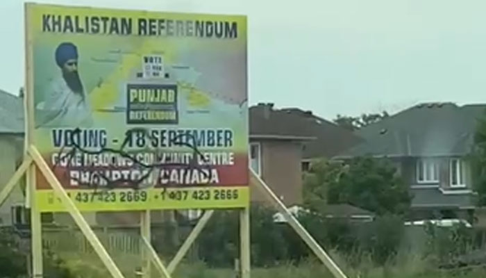 Screengrab of video showing vandalised poster on a billboard promoting September 18 voting for Khalistan Refrendum. — by author