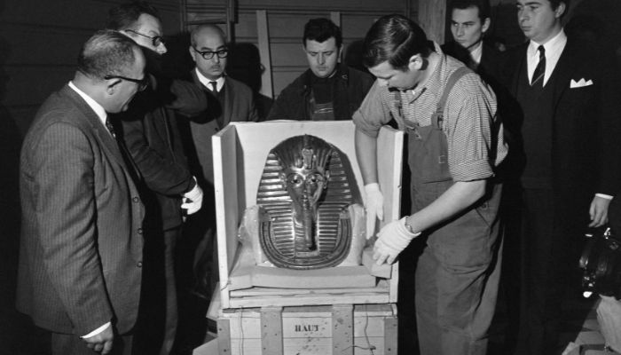 In this file photo taken on February 8, 1967 members of the Petit Palais Museum reveal the burial mask of the ancient Egyptian Pharaoh Tutankhamun as they open the crates containing the items of the Tutankhamun treasure exhibition, in Paris. Ahead of the bicentenary of the deciphering of the Rosetta Stone -- which unlocked the key to reading ancient hieroglyphs -- and the 100th anniversary of Carter´s earth-shattering discovery, Egyptians are demanding that their contributions to the discoveries be recognised and artefacts abroad returned