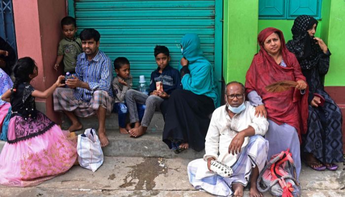 people wait to see Sufi leader Syed Emdadul Hoque at the Maizbhandar Darbar Sharif shrine in Maizbhandar. Evil spirits bedevil the families that seek blessings from an elderly Bangladeshi mystic -- but he knows that his prayers alone are not enough to soothe their troubled minds.