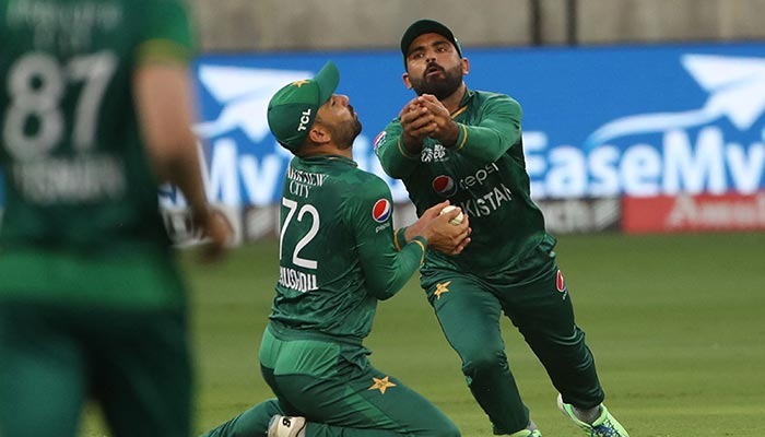 Pakistans Khushdil Shah (#72) collides with his teammate Fakhar Zaman (R) before taking a catch to dismiss India´s captain Rohit Sharma (not pictured) during the Asia Cup Twenty20 international cricket Super Four match between India and Pakistan at the Dubai International Cricket Stadium in Dubai on September 4, 2022.