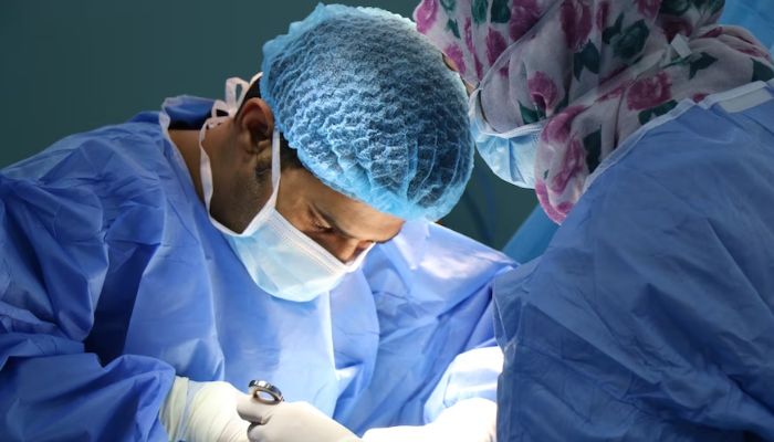 (Representational) Surgeons performing an operation. — Unsplash