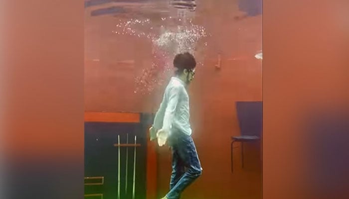 Jaydeep Gonhil seen dancing underwater in this screengrab of a video posted on Instagram.