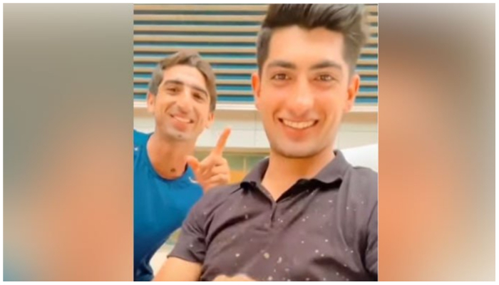 Image showing Shahnawaz Dahani (L) and Naseem Shah smiling at the camera. — Twitter