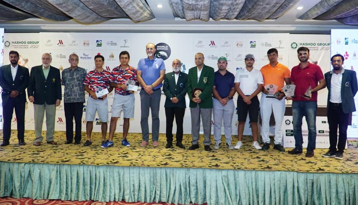 Golfers and awardees stand alongside distinguished guests following the Hashoo Group World Corporate Golf Challenge (WCGC) Pakistan in Lahore.  — Photo by WCGC