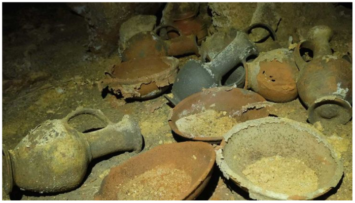 A handout picture provided by the Israel Antiquities Authority on September 18, 2022, shows finds including pottery vessels, dating back to the thirteenth century BCE during the rule of Egypts Pharaoh Rameses II, discovered untouched in a funerary cave at the central Palmachim park area on the Mediterranean coast. — AFP