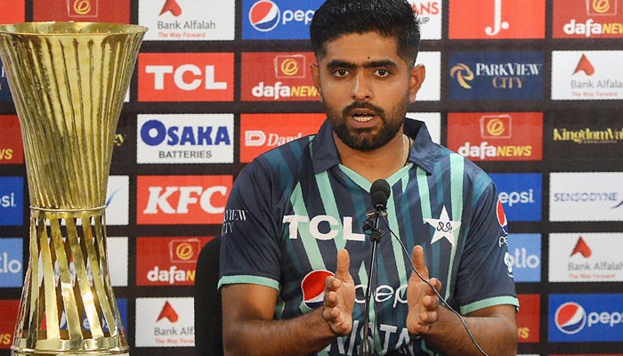Pakistans captain Babar Azam speaks during a press conference next to T20 series trophy at the National Cricket Stadium in Karachi on September 19, 2022, on the eve of their first T20 international cricket match against England. — AFP