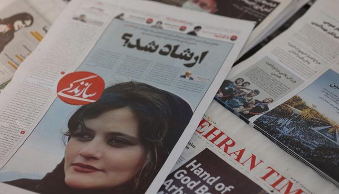 A newspaper with a cover picture of Mahsa Amini, a woman who died after being arrested by the Islamic republics morality police is seen in Tehran, Iran September 18, 2022. — Reuters/File