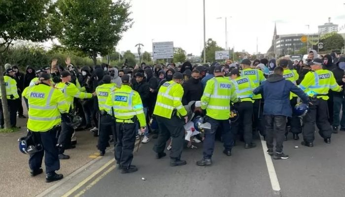 Leicestershire Police dealing with men who took to streets in the British city. — BBC
