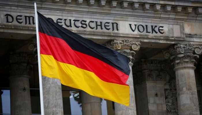 The German flag is seen outside Germanys Bundestag, the lower house of parliament. in Berlin, Germany, March 14, 2018. — Reuters