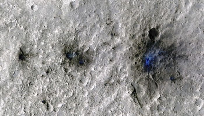 Craters formed by a September 5, 2021, meteoroid impact on Mars, the first to be detected by NASAs InSight, are seen in an image taken by NASAs Mars Reconnaissance Orbiter. — Reuters
