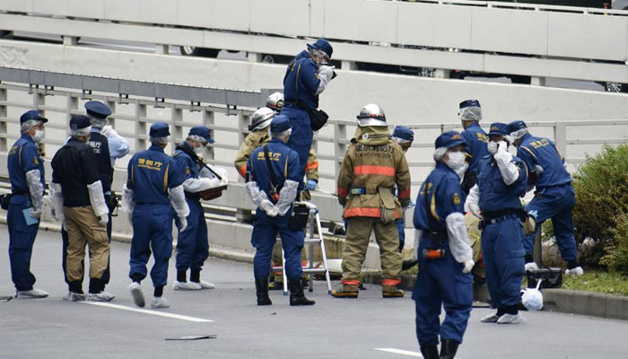 Police officers and firefighters investigate at the site where a man who was protesting a state funeral for former Japanese Prime Minister Shinzo Abe set himself on fire, near Prime Minster Fumio Kishidas official residence in Tokyo, Japan September 21, 2022. — Reuters