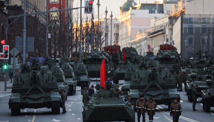 Russian service members drive tanks along a street during a rehearsal for the Victory Day military parade in Moscow, Russia May 4, 2022. — Reuters