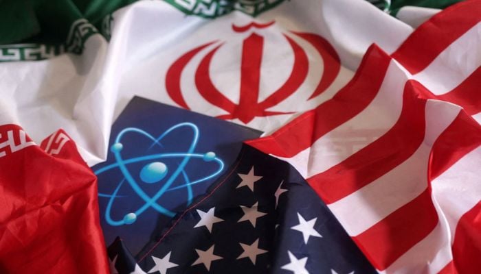 Atomic symbol, USA and Iranian flags are seen in this illustration taken September 8, 2022. — Reuters