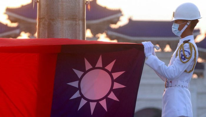 Honour guards lower the Taiwan flag during sunset hours at Liberty Square in Taipei, Taiwan, July 28, 2022. — Reuters