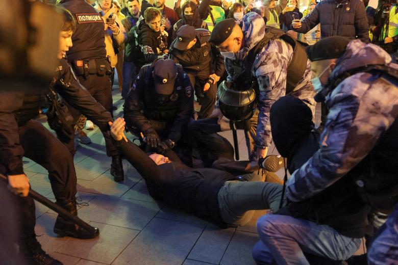 Russian police officers detain a man during an unsanctioned rally, after opposition activists called for street protests against the mobilization of reservists ordered by President Vladimir Putin, in Moscow, September 21.