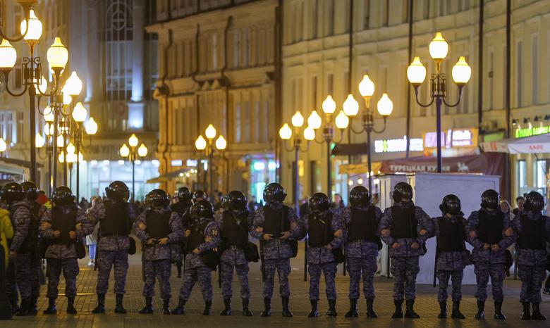 Russian police officers stand guard during an unsanctioned rally, after opposition activists called for street protests against the mobilization of reservists ordered by President Vladimir Putin, in Moscow, September 21.