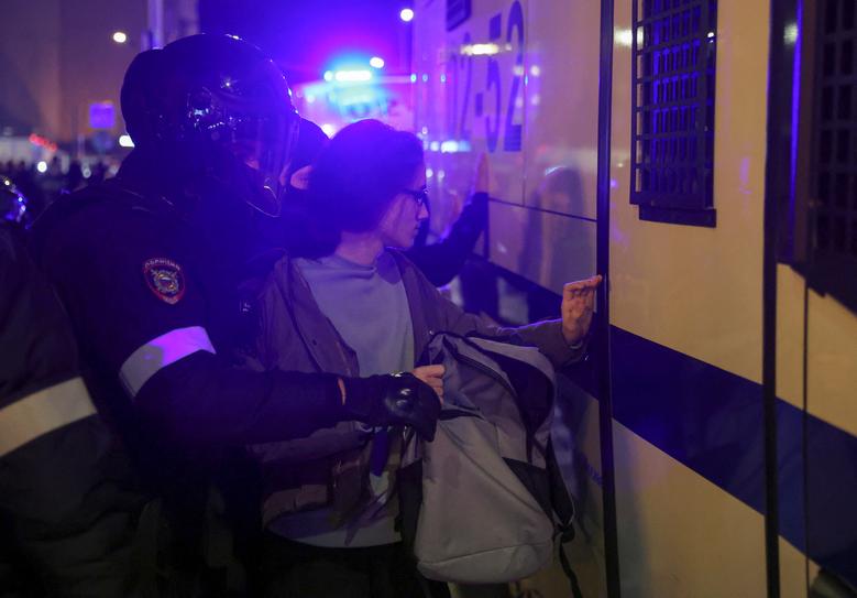 Russian police officers detain a person during an unsanctioned rally, after opposition activists called for street protests against the mobilization of reservists ordered by President Vladimir Putin, in Moscow, Russia September 21.