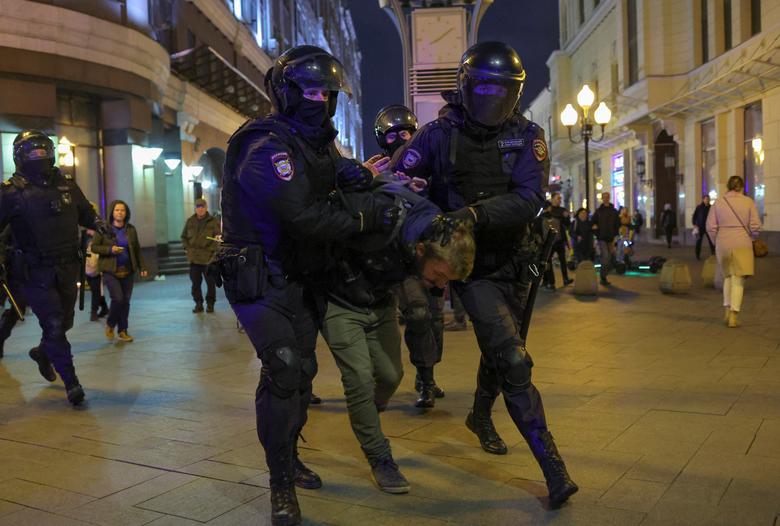 Russian police officers detain a man during an unsanctioned rally, after opposition activists called for street protests against the mobilization of reservists ordered by President Vladimir Putin, in Moscow, September 21.