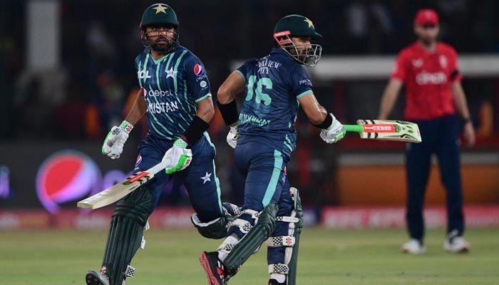 Pakistans captain Babar Azam (L) and teammate Mohammad Rizwan run between the wickets during the first T20 international cricket match between Pakistan and England at the National Cricket Stadium in Karachi on September 20, 2022. — AFP/File