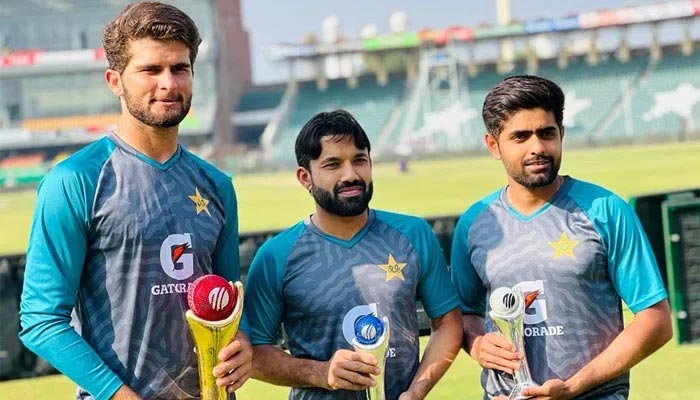 (R to L) Pakistan captain Babar Azam, wicket-keeper-batter Mohammad Rizwan, and fast bowler Shaheen Shah Afridi pose with their ICC trophies at Lahores Gaddafi Stadium, on March 19, 2022. — Twitter/@iShaheenAfridi