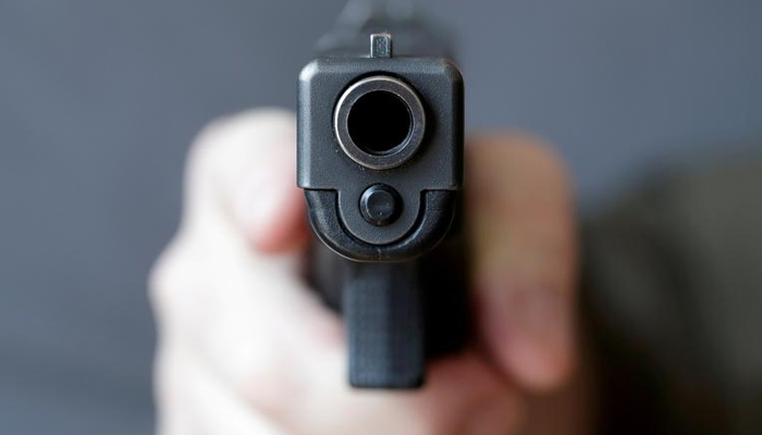 A man holds a gun in this Reuters fille image.