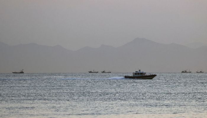 A Taiwan Coast Guard ship travels past the coast of China, in the waters off Nangan island of Matsu archipelago in Taiwan August 16, 2022. — Reuters