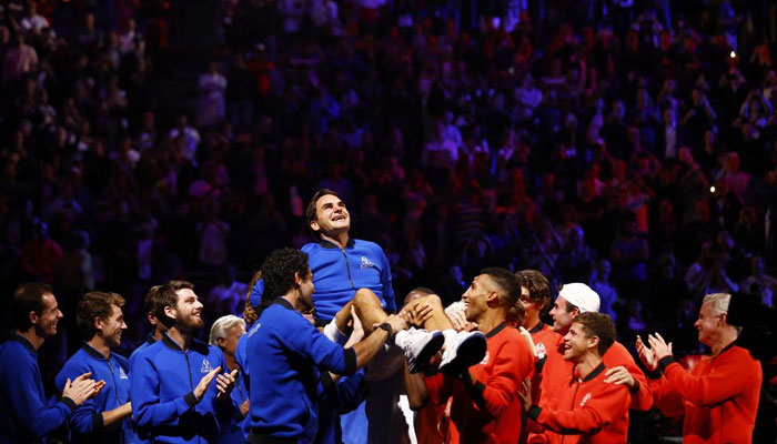 Team Europe and World members lift Roger Federer at the end of his last match after announcing his retirement on September 24, 2022. — Reuters