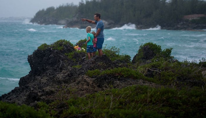 Locals watch as increasing wind pushes waves towards the south shore before the arrival of Hurricane Fiona in Bermuda September 22, 2022. — Reuters