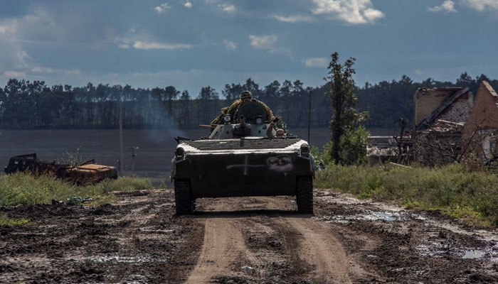 Ukrainian service members ride in an armoured fighting vehicle, amid Russias attack on Ukraine, in Kharkiv region, Ukraine September 24, 2022. — Reuters