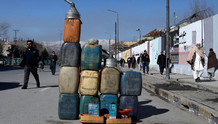 Cans containing gasoline are kept for sale on a road in Kabul, Afghanistan, January 27, 2022. REUTERS