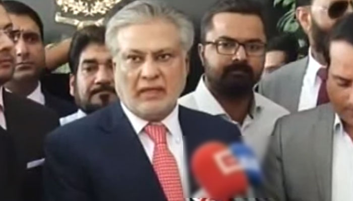 Federal Minister Ishaq Dar (R) speaking to journalists. — Geo News/Screengrab