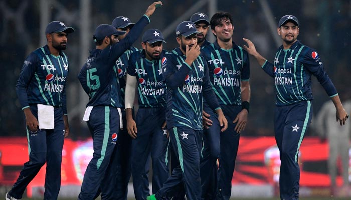 Pakistan´s players celebrate after the dismissal of England´s Ben Duckett (not pictured) during the fifth Twenty20 international cricket match between Pakistan and England at the Gaddafi Cricket Stadium in Lahore on September 28, 2022. — AFP