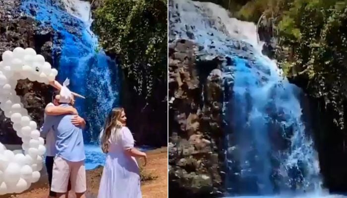 The 18-metre-high Queima-Pe River waterfall can be seen turned blue.— Screengrabs via social media videos/NYP