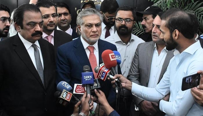 Federal Minister for Finance and Revenue Ishaq Dar talking to media persons on his arrival at Finance Ministry on September 28, 2022. — PID