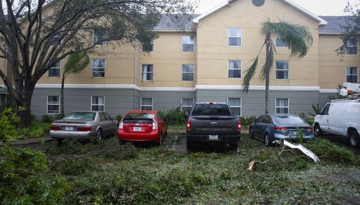 Fallen trees and debris are seen in a parking lot as Hurricane Ian makes landfall in southwestern Florida, in Fort Myers, Florida, US September 28, 2022.