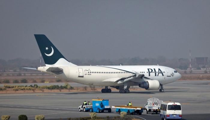 A Pakistan International Airlines (PIA) plane prepares to take-off at Alama Iqbal International Airport in Lahore. — Reuters/Files