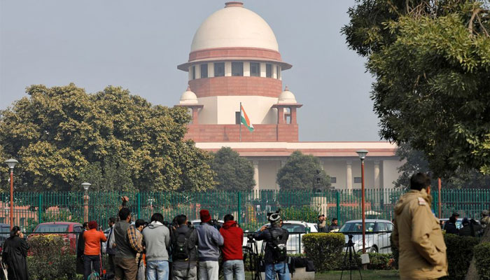 Television journalists are seen outside the premises of the Supreme Court in New Delhi, India, January 22, 2020. — Reuters